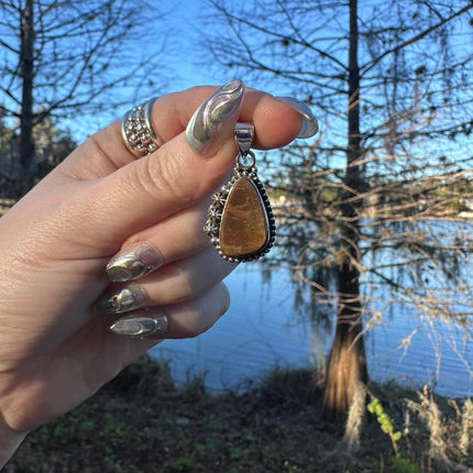 Sterling Silver Ammolite Pendant. Approx 1.5 inches. Yellow/Brown Shift