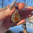 Sterling Silver Ammolite Pendant. Approx 1.5 inches. Yellow/Brown Shift