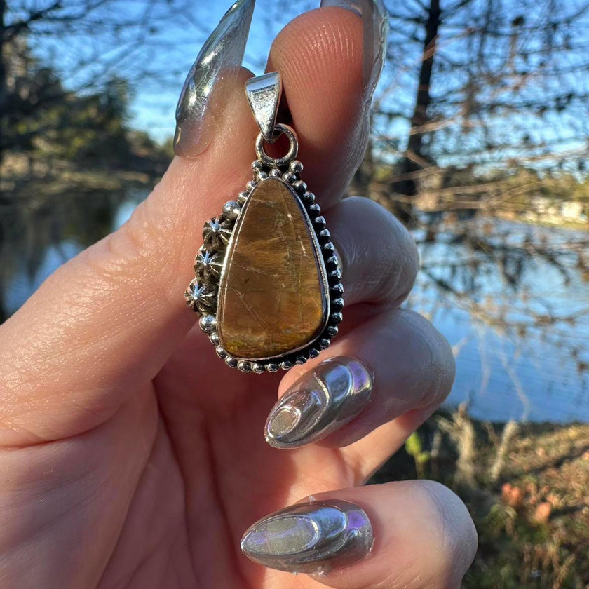 Sterling Silver Ammolite Pendant. Approx 1.5 inches. Yellow/Brown Shift
